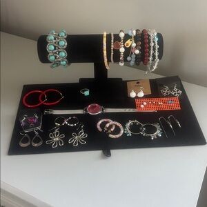Lot of silvertone bracelets and earrings and a working watch